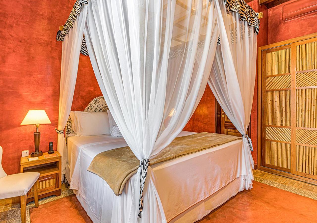 Dpny Beach Hotel & Spa Ilhabela Dış mekan fotoğraf A bed with a mosquito net