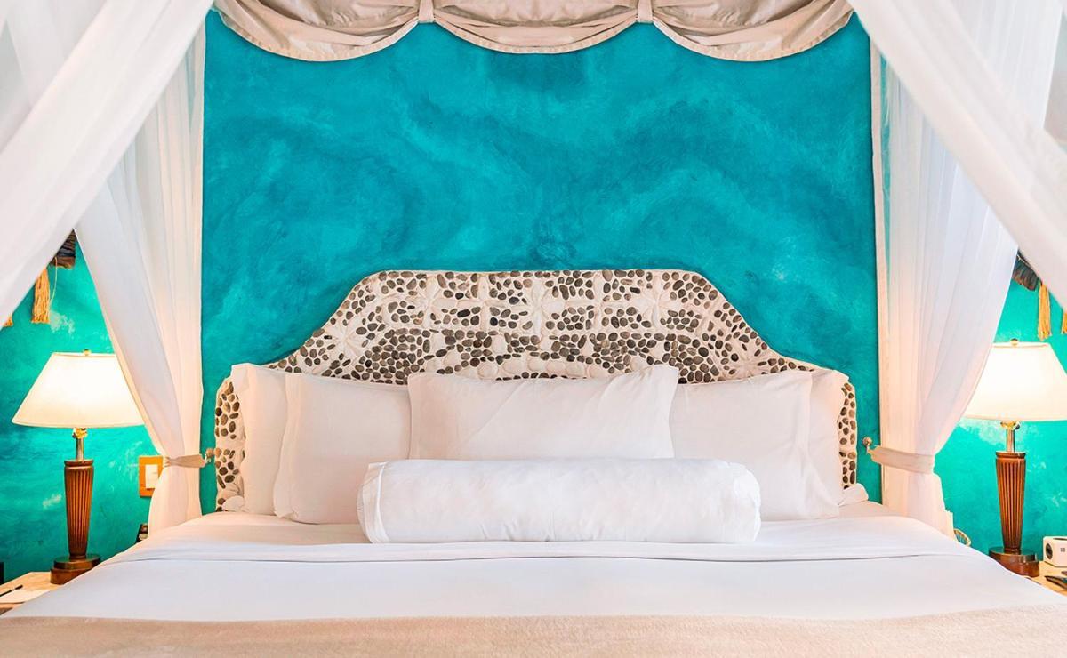 Dpny Beach Hotel & Spa Ilhabela Dış mekan fotoğraf A bed with a headboard